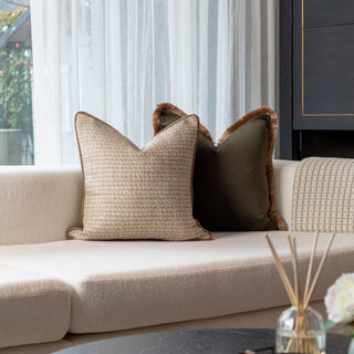 Decorative cushions on a beige sofa 