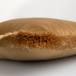 Brown fur pillow on a white background