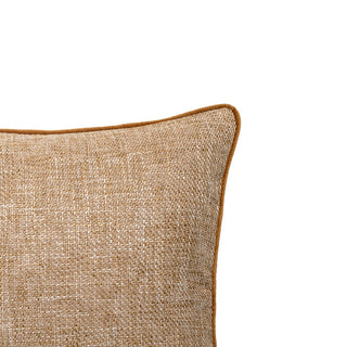 Textured beige pillow on a white background