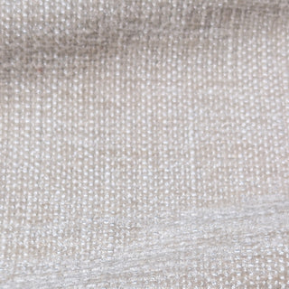 Close-up of textured beige fabric with a subtle pattern